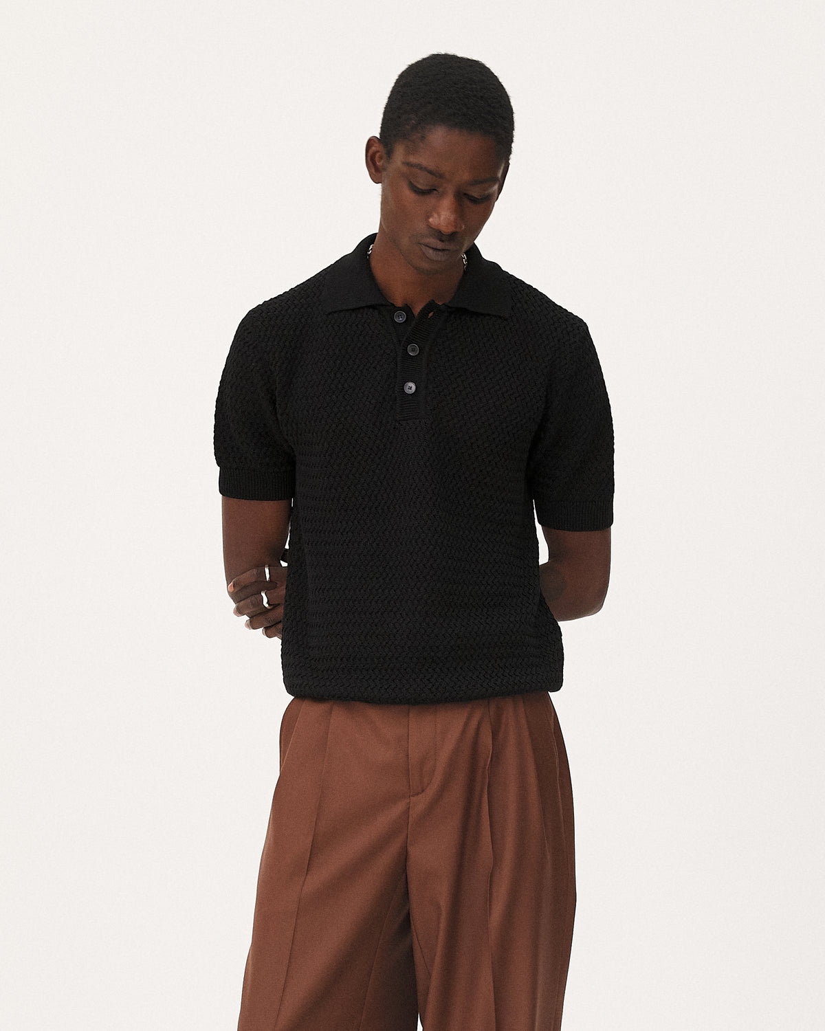 Haring Black polo, SS26 menswear studio look